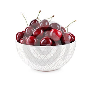 Tasty ripe red cherries in bowl isolated