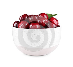 Tasty ripe red cherries in bowl isolated