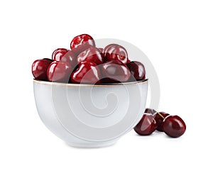 Tasty ripe red cherries and bowl isolated