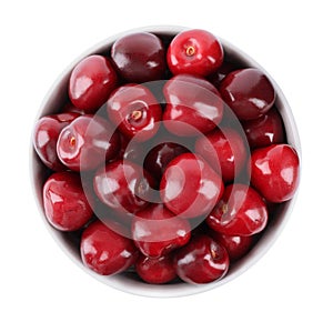 Tasty ripe red cherries in bowl isolated, top view