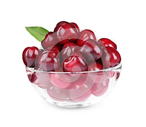 Tasty ripe red cherries in glass bowl isolated