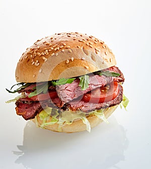 Tasty roast beef or pastrami burger with rocket