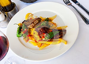 Tasty roasted beef with vegetable stew on plate