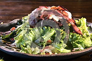 Tasty roasted hamburger meat served with vegetable salad