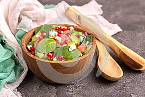 Tasty salad with grapefruit, spinach, feta, avocado and pomegranate