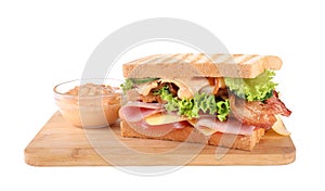 Tasty sandwich with ham and bacon isolated on white