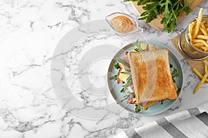 Tasty sandwich with toasted bread served on marble table, top view. Space for text