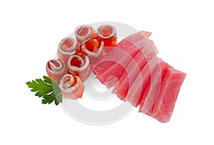 Tasty sashimi (slices of fresh raw tuna and salmon) with parsley isolated on white, above view