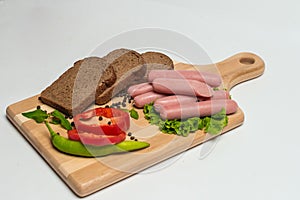 Tasty sausage and bread with lettuce and tomato for lunch and dinner