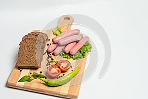 Tasty sausage and bread with lettuce and tomato for lunch and dinner