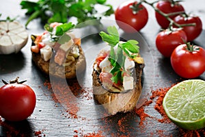 Tasty savory tomato Italian bruschetta, on slices of toasted baguette garnished with parsley