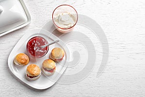 Tasty scones with clotted cream and jam