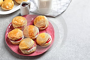 Tasty scones with clotted cream and jam