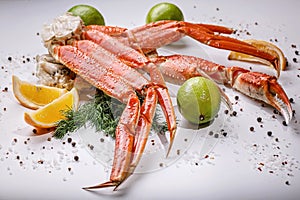 Tasty seafood. Crab claws on white background. Horisontal shot. Close-up