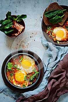 Tasty Shakshuka, Fried Eggs in Tomato Sauce for Easter Brunch. Eggs Poached in Spicy Tomato Pepper Sauce.