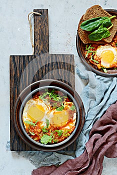 Tasty Shakshuka, Fried Eggs in Tomato Sauce for Easter Brunch. Eggs Poached in Spicy Tomato Pepper Sauce.