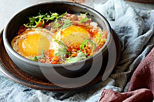 Tasty Shakshuka, Fried Eggs in Tomato Sauce for Easter Brunch. Eggs Poached in Spicy Tomato Pepper Sauce.