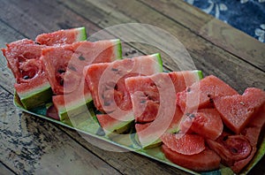 Tasty sliced watermelon on table. Cut the watermelon, red, green,