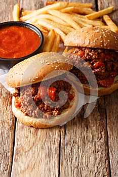 Tasty Sloppy Joe sandwiches with beef and French fries, ketchup