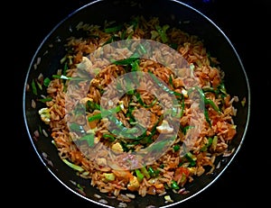 Tasty and spicy Chinese fried or Schezwan rice made at home