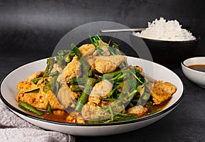 Tasty Stir-fried pork and red hot curry paste with asparagus bean or long bean and  Ingredients are oyster sauce, fish sauce,