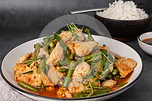 Tasty Stir-fried pork and red hot curry paste with asparagus bean or long bean and  Ingredients are oyster sauce, fish sauce,