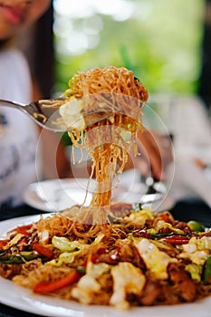 Tasty stir fry rice noodle with meat and vegetables, Asian food celebration