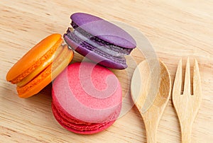 Tasty Sweet Macaroons on wooden background