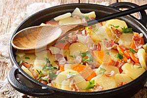 Tasty Tatws Pum Munud British dish  close-up in a frying pan. Horizontal