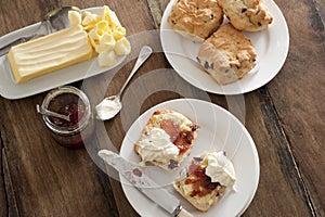 Tasty teatime with fruit scones, butter and cream