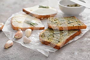 Tasty toasted bread with spreads on table