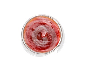 Tasty tomato sauce in bowl on white background