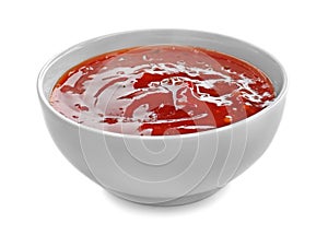 Tasty tomato sauce in bowl on white background