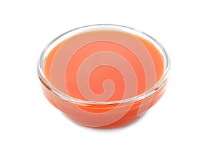 Tasty tomato sauce in glass bowl on white background