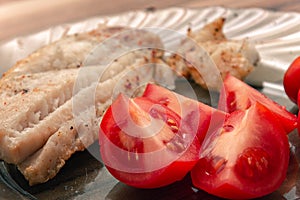 Tasty tomatoes pieces served with fish