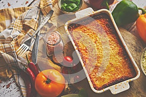 Tasty traditional italian lasagna with bolognese, melted and cheese. Served with ingredients