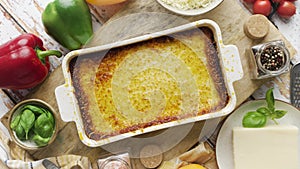 Tasty traditional italian lasagna with bolognese, melted and cheese. Served with ingredients