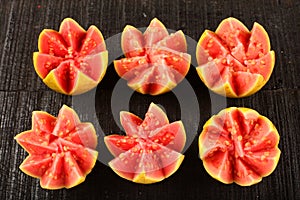 Tasty tropical red guava fruits. artistically sliced.