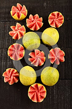 Tasty tropical red guava fruits. artistically sliced.