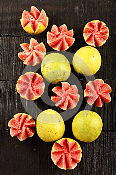 Tasty tropical red guava fruits. artistically sliced.