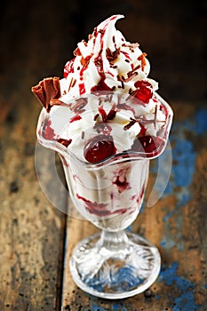 Tasty vanilla ice-cream with cherries