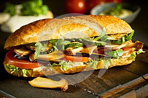 Tasty vegan baguette with mushrooms and greens