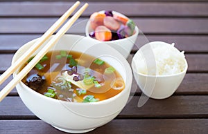 Tasty vegan miso soup with a small bowl of rice and fermented vegetables