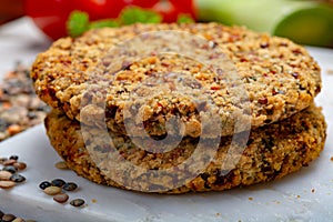 Tasty vegetarian food, raw burgers made from lentils legumes with vegetables ready for cooking