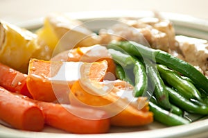 Tasty vegetarian lunch or dinner with carrots, pumpkin, and green beans