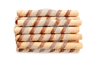 Tasty wafer roll sticks on white background, top view.