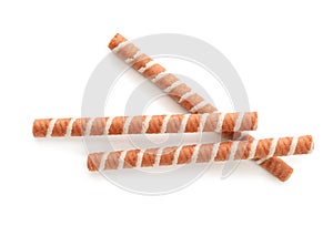 Tasty wafer roll sticks on white background, top view.