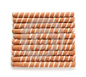 Tasty wafer roll sticks on white background, top view.