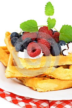 Tasty waffles with summery fruits