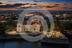 Tata, Hungary - Aerial view of the beautiful illuminated Castle of Tata by the Old Lake Ãâreg-to at dusk with colorful sunset photo